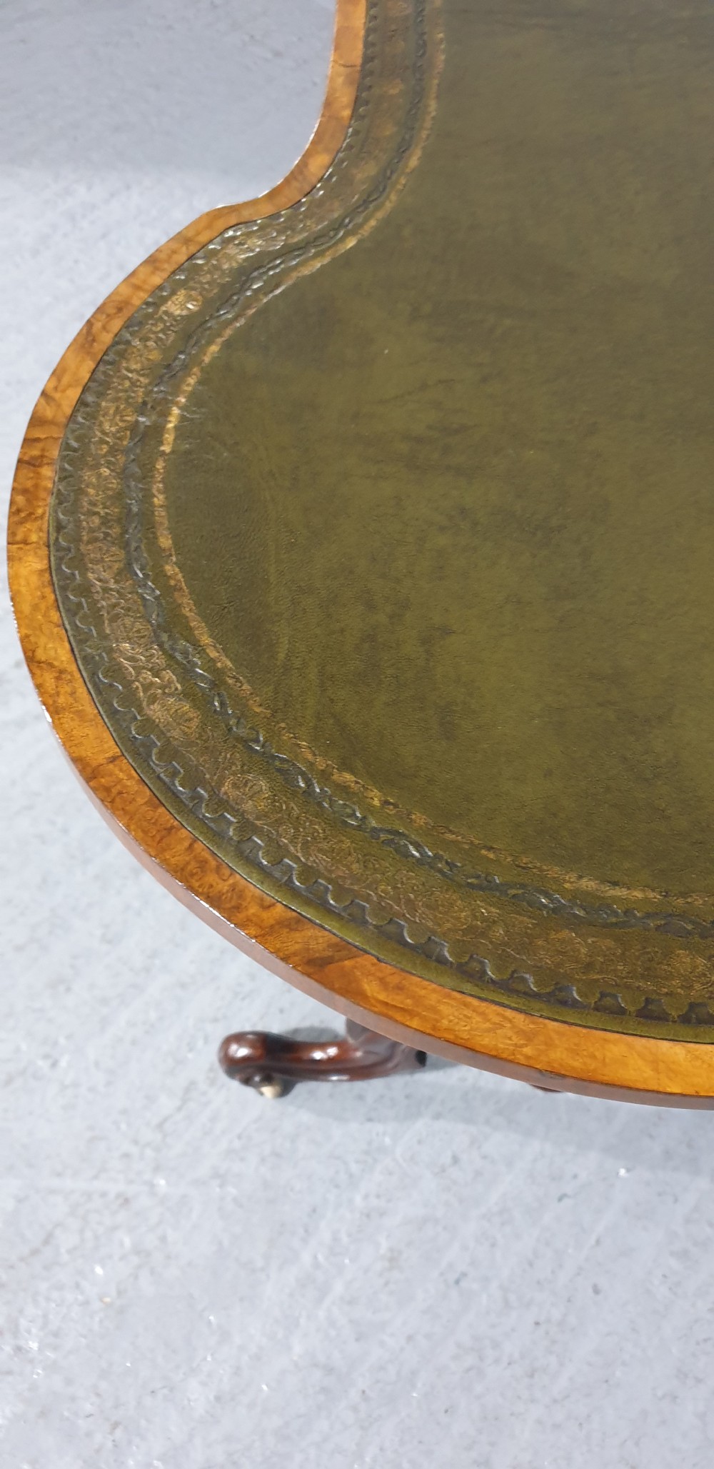 A Victorian kidney-shaped writing desk crafted from burr walnut with a green leather inset top and carved turned legs joined by a stretcher. View IX