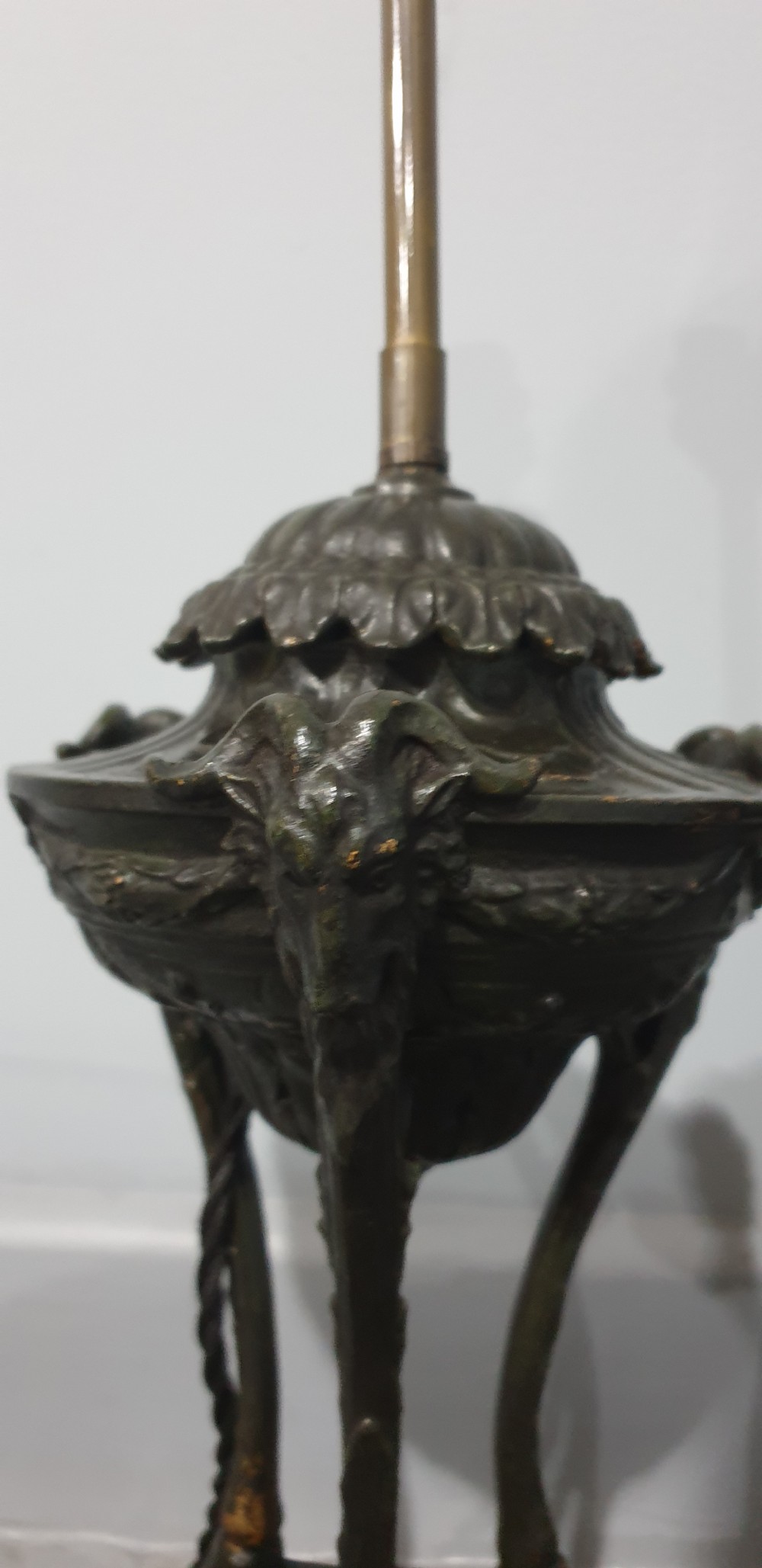 A pair of French spelter table lamps crafted in the form of classical urns set on square veined marble bases. View IV