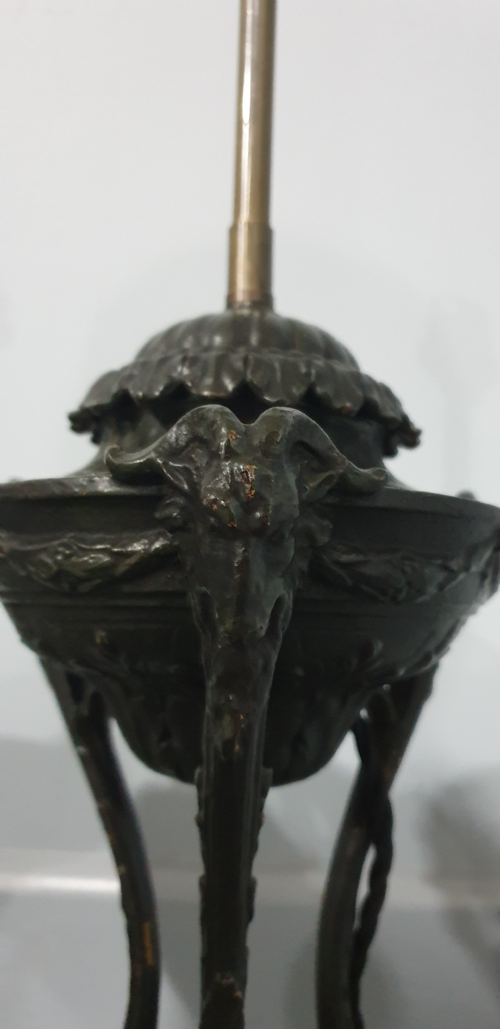 A pair of French spelter table lamps crafted in the form of classical urns set on square veined marble bases. View V