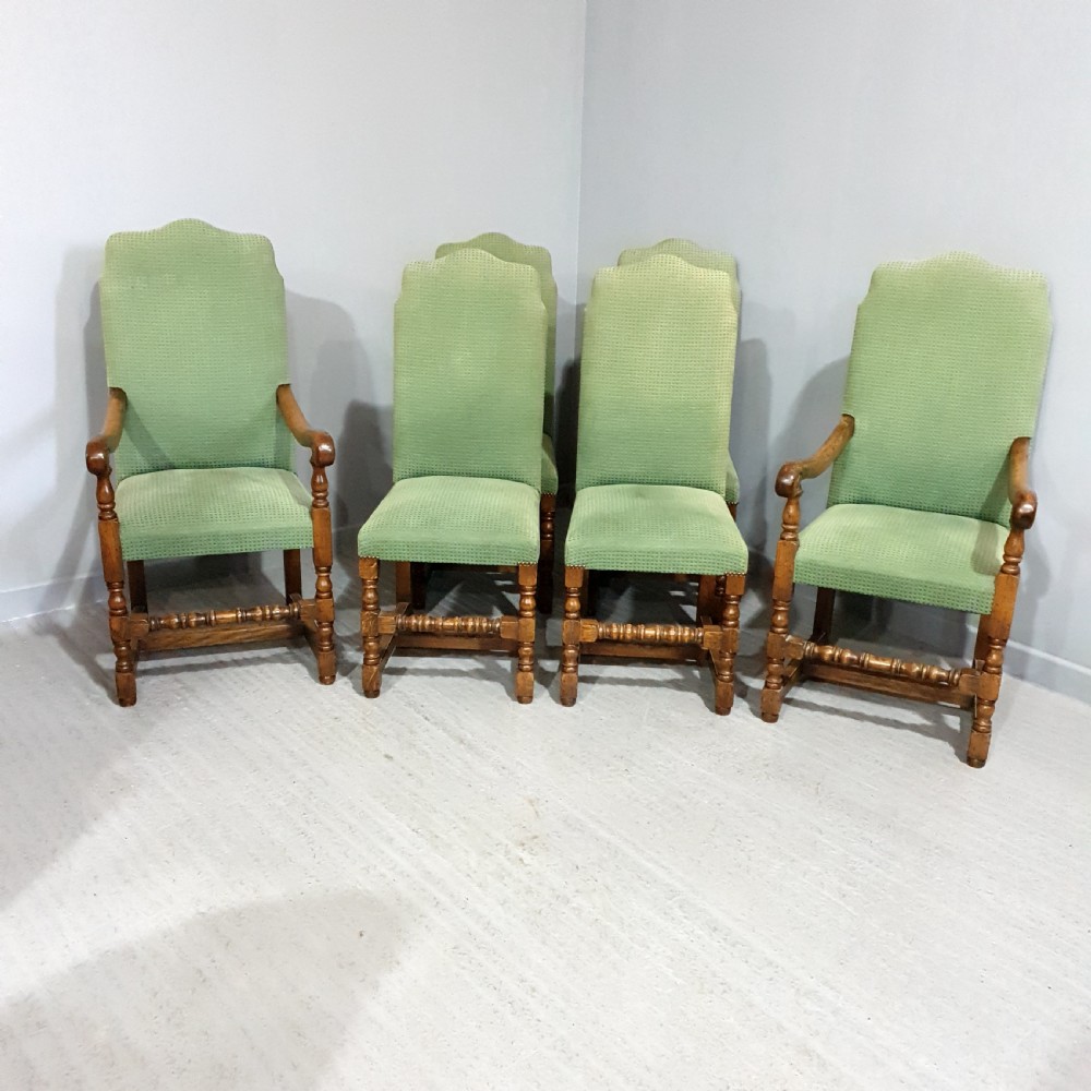 A set of six oak dining chairs with green textured upholstery, including two open-arm carvers and four side chairs with turned legs and stretchers. View II