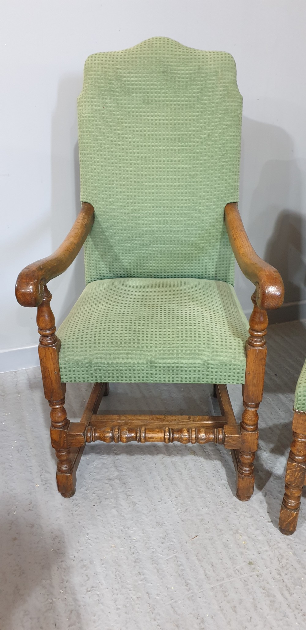 A set of six oak dining chairs with green textured upholstery, including two open-arm carvers and four side chairs with turned legs and stretchers. View VIII
