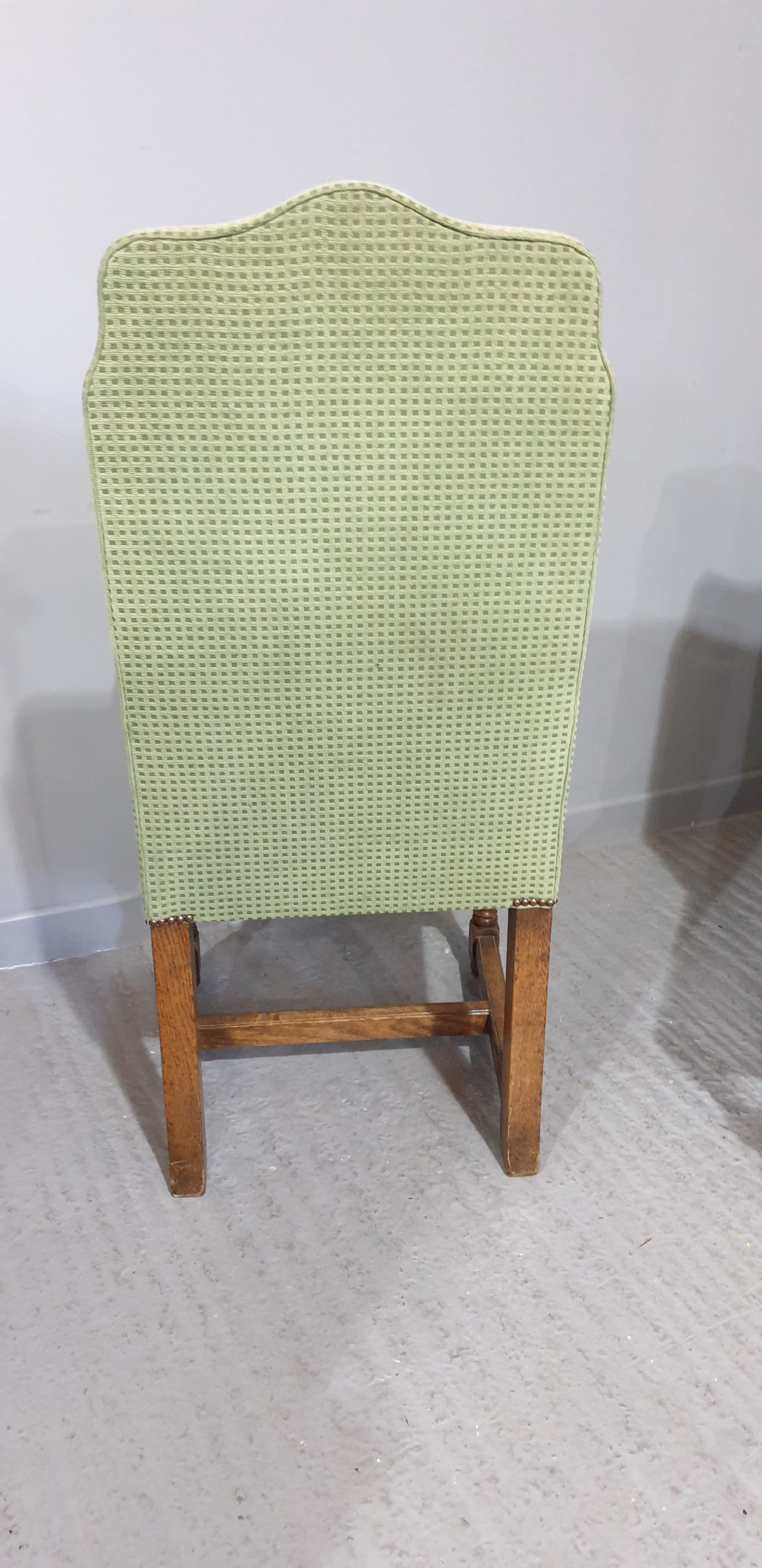 A set of six oak dining chairs with green textured upholstery, including two open-arm carvers and four side chairs with turned legs and stretchers. View XI