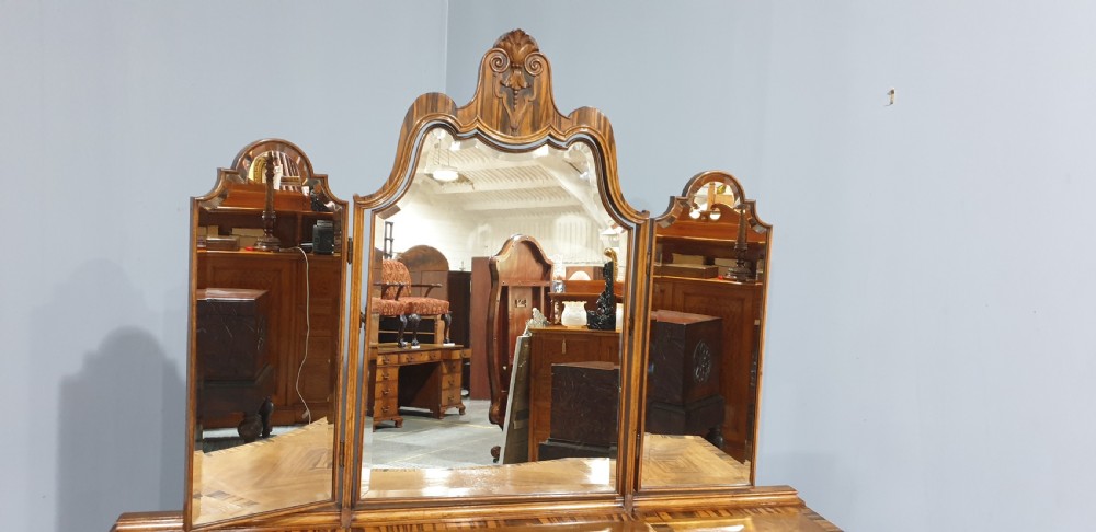 An Edwardian wooden dressing table featuring herringbone parquetry veneers, five drawers, carved legs with a curved stretcher, and an adjustable triple mirror. View II