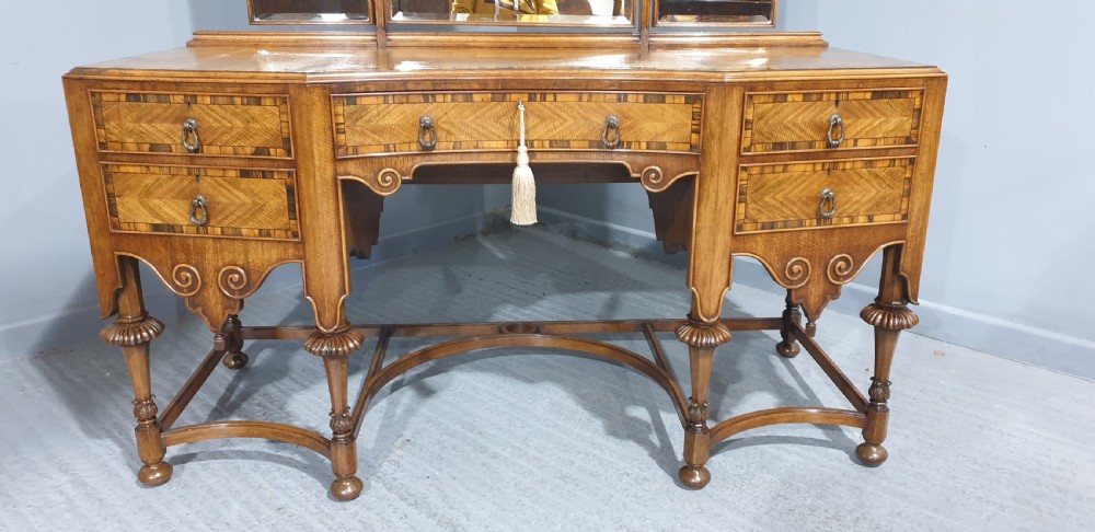 An Edwardian wooden dressing table featuring herringbone parquetry veneers, five drawers, carved legs with a curved stretcher, and an adjustable triple mirror. View VIII