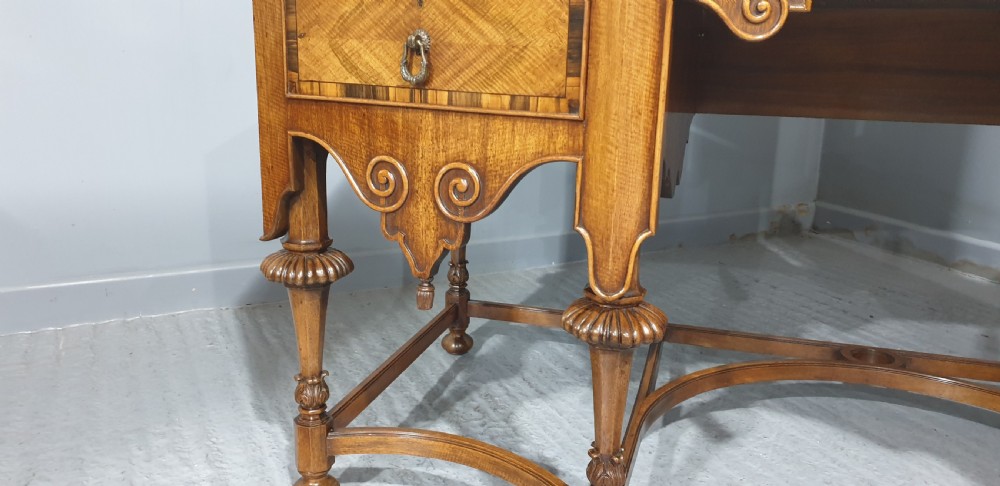 An Edwardian wooden dressing table featuring herringbone parquetry veneers, five drawers, carved legs with a curved stretcher, and an adjustable triple mirror. View IX