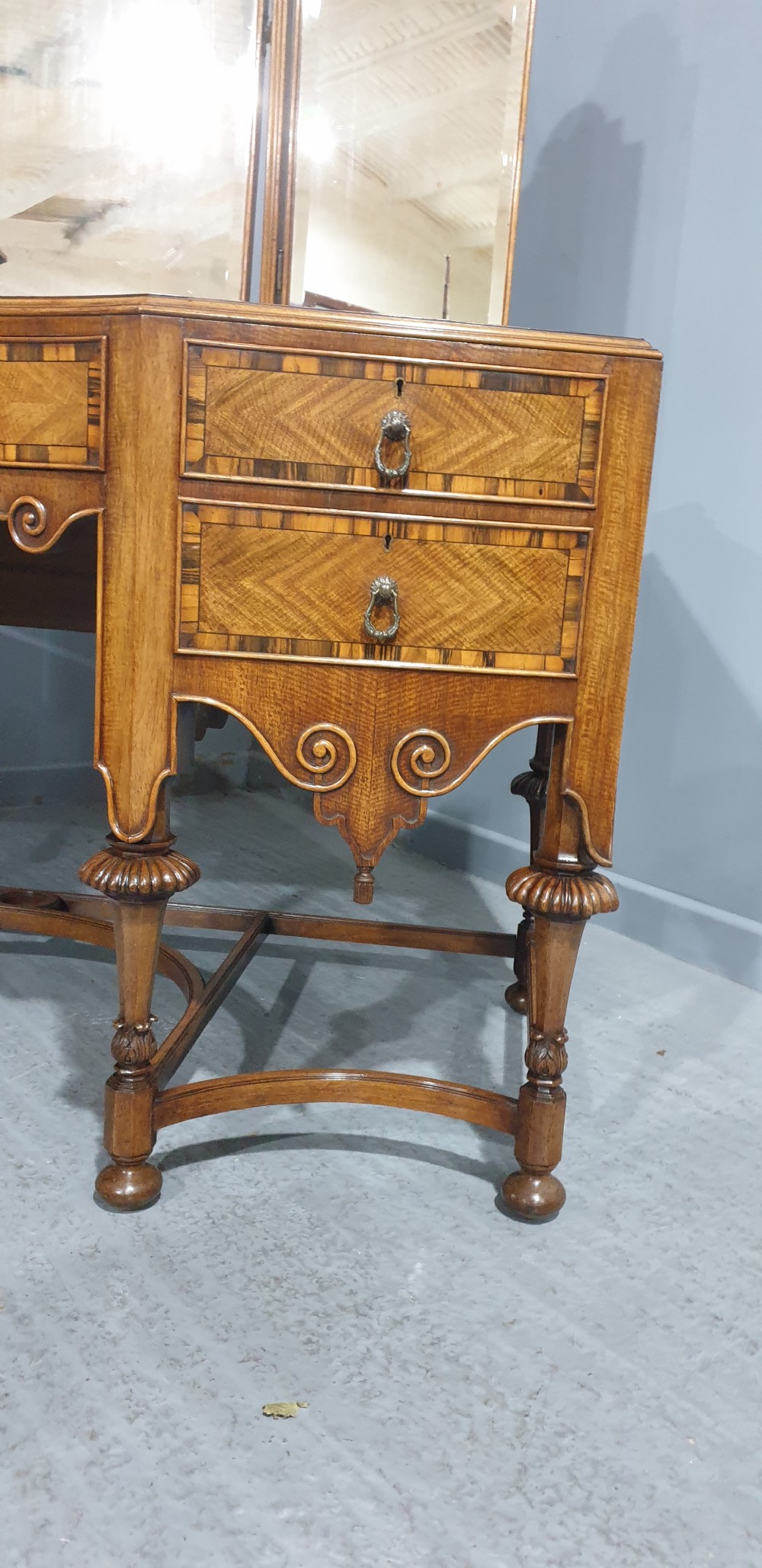 An Edwardian wooden dressing table featuring herringbone parquetry veneers, five drawers, carved legs with a curved stretcher, and an adjustable triple mirror. View X