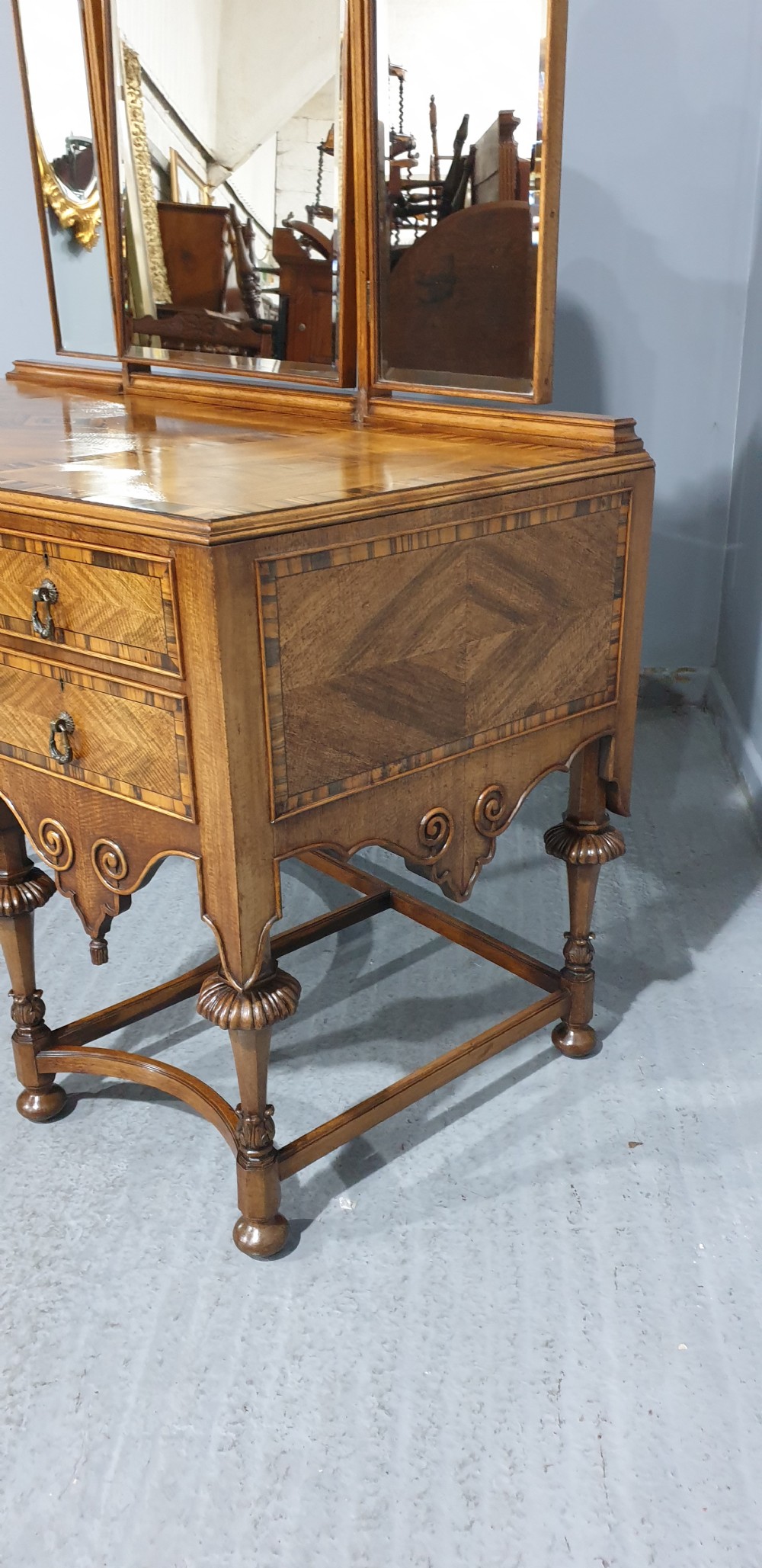 An Edwardian wooden dressing table featuring herringbone parquetry veneers, five drawers, carved legs with a curved stretcher, and an adjustable triple mirror. View XV