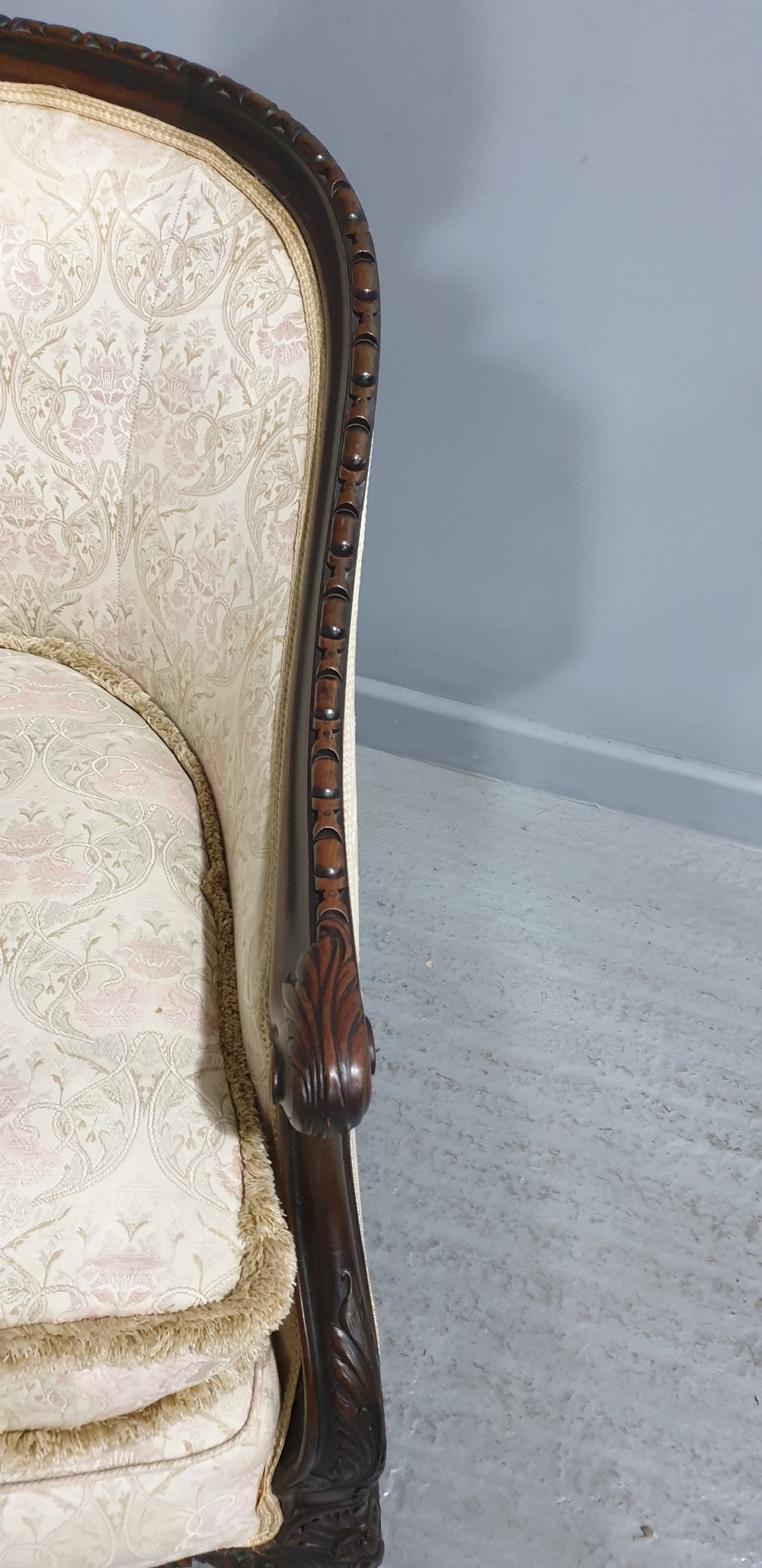 A pair of Victorian mahogany hoop-backed easy chairs upholstered in cream patterned damask fabric with carved legs on brass castors. View VIII
