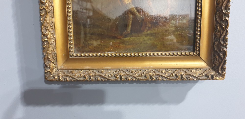 A nineteenth-century framed oil painting on board depicting a man and woman in historical costume dancing in a landscape setting, enclosed within an ornate carved gold frame. View VI