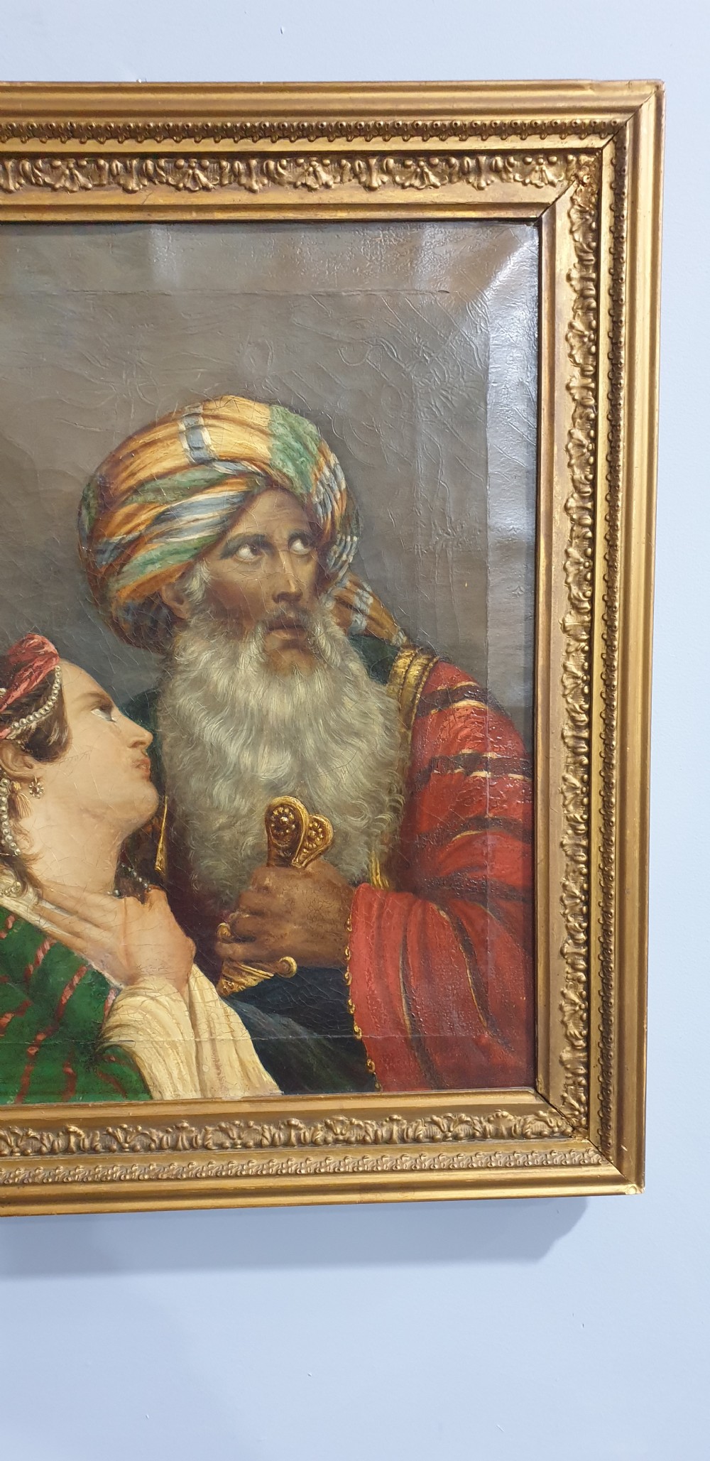 An antique framed oil painting on canvas depicting a bearded man in a turban alongside a woman looking upward. View III
