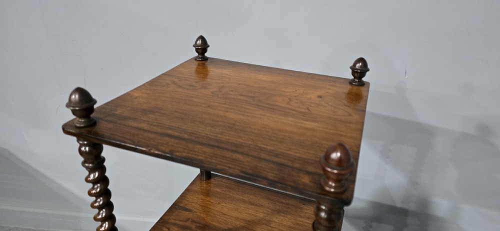 A three-tier William IV dark wood etagere featuring spiral twist uprights, top finials, a lower single drawer, and brass castors. View VIII