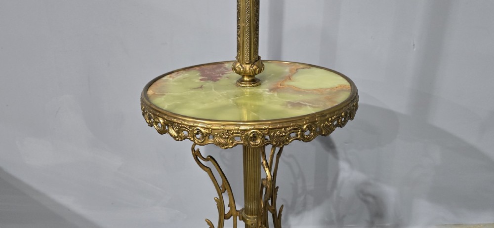 An antique cast brass standard lamp featuring an integrated circular green onyx tray and tripod scroll legs. View V