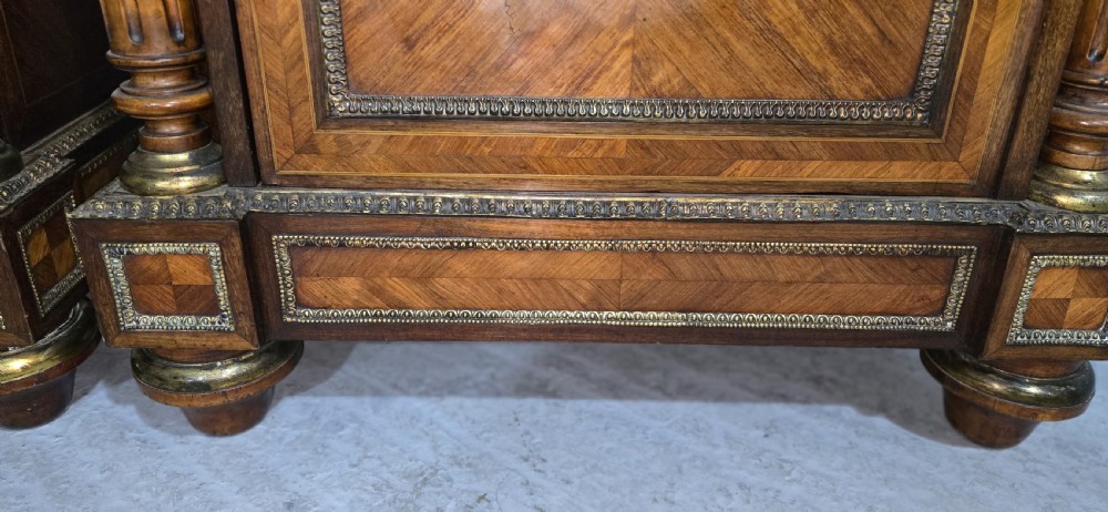 A pair of tall French Louis XVI style wooden side cabinets featuring parquetry veneers, fluted columns, gilt-bronze mounts, and central oval porcelain plaques painted with cherubs. View XI