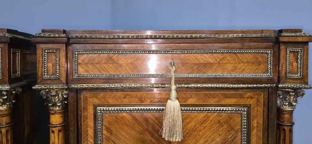 A pair of tall French Louis XVI style wooden side cabinets featuring parquetry veneers, fluted columns, gilt-bronze mounts, and central oval porcelain plaques painted with cherubs. View XII