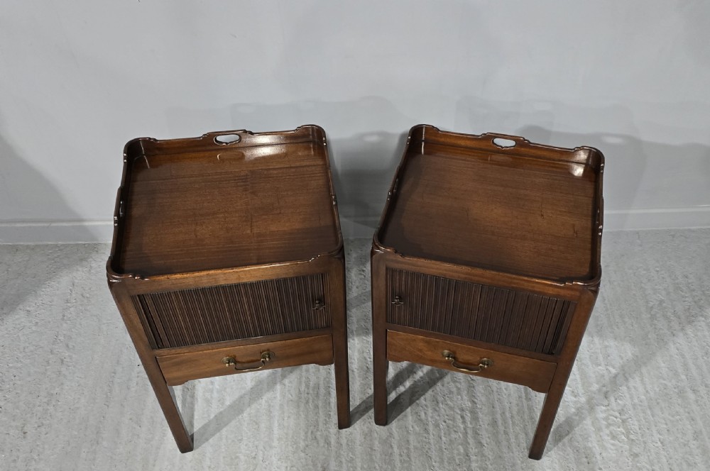 An oval Georgian mahogany butlers tray table featuring folding hinged sides with cutout handles on four straight legs. View VII