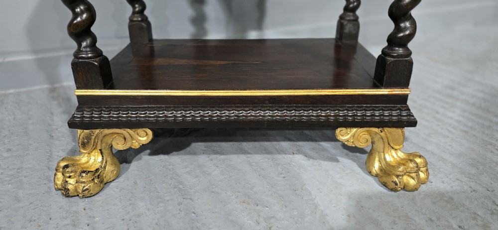 A rectangular dark rosewood two-tier side table featuring spiral turned legs, gilt borders, and carved gilded paw feet. View III