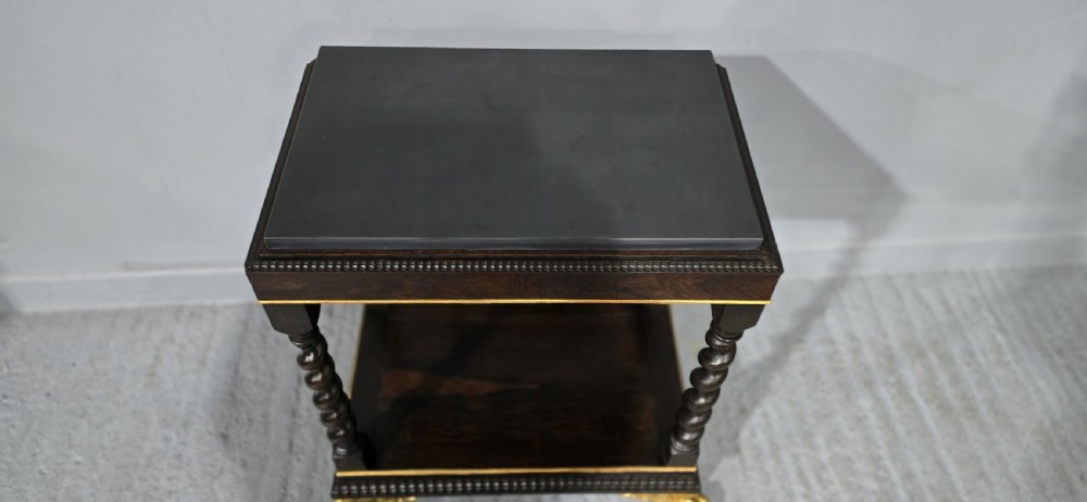 A rectangular dark rosewood two-tier side table featuring spiral turned legs, gilt borders, and carved gilded paw feet. View IX