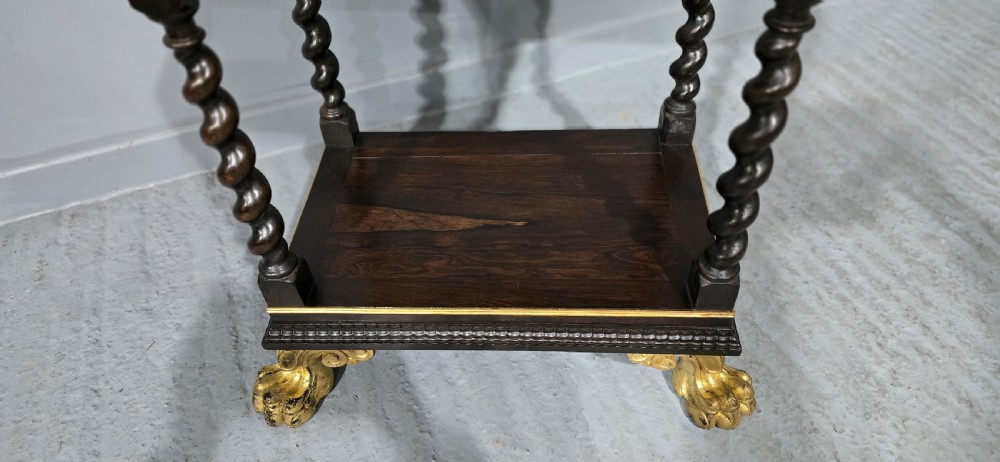 A rectangular ebonised black wood centre table featuring gold parcel gilded accents, spiral barley twist legs, drop finials, and an H-stretcher. View XVI