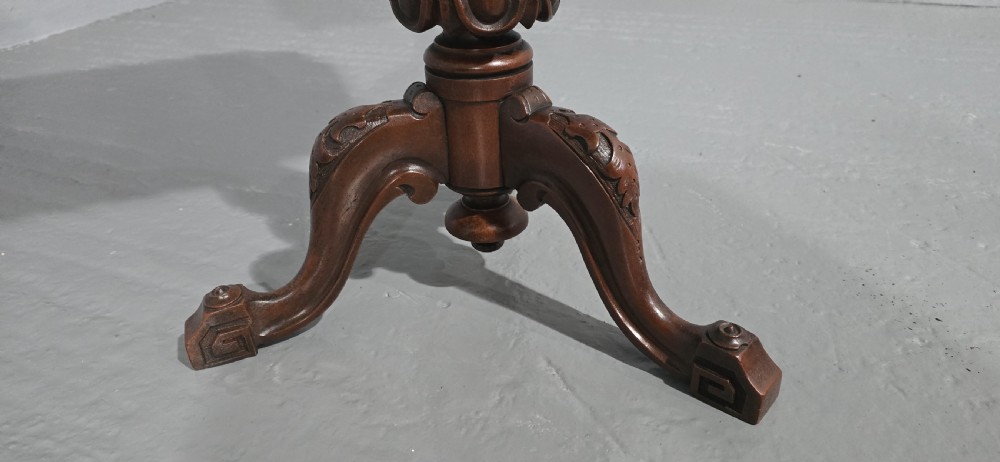A Victorian mahogany pedestal table featuring a scalloped rim with turned pendant drops, a spiral carved central column, and tripod cabriole legs. View V