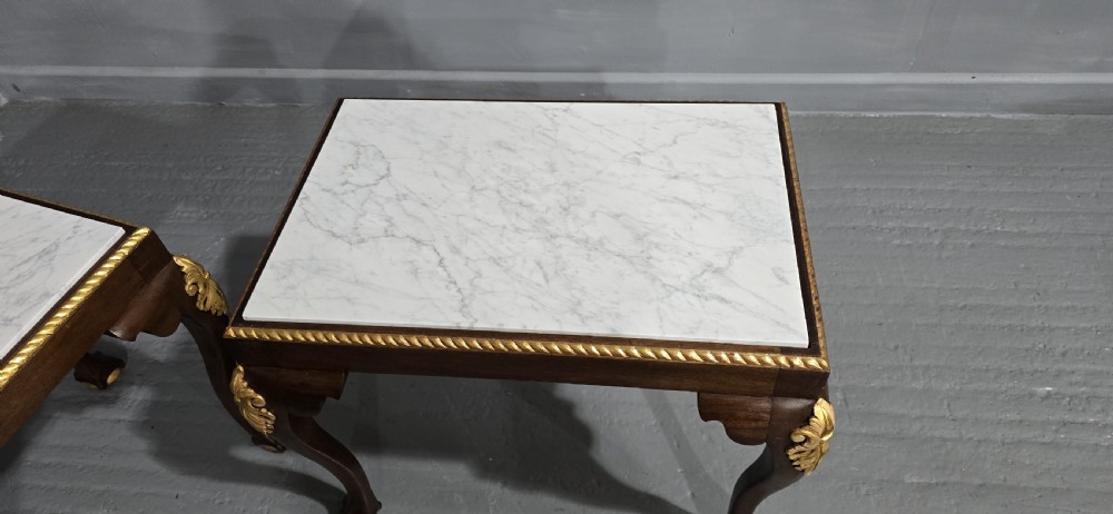 A pair of rectangular dark mahogany lamp tables featuring white marble inset tops, gilded acanthus leaf carvings, and carved cabriole legs with ball and claw feet. View III