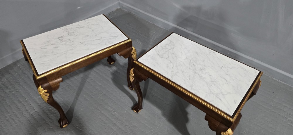 A pair of rectangular dark mahogany lamp tables featuring white marble inset tops, gilded acanthus leaf carvings, and carved cabriole legs with ball and claw feet. View V