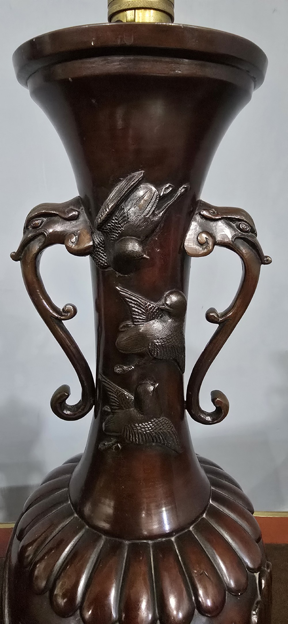 A pair of dark brown bronze urn-shaped table lamps featuring relief carvings of dragons and birds on turned wooden bases. View III