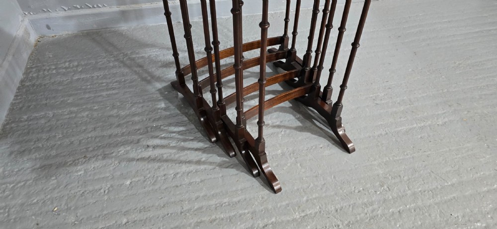 A set of four graduated mahogany quartetto tables featuring oval inlaid tops, ring-turned spindle legs, and curved stretchers. View VIII