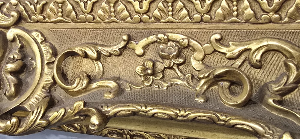 A pair of matching rectangular wall mirrors featuring gold giltwood frames embellished with ornate shell motifs and relief scrollwork. View VII