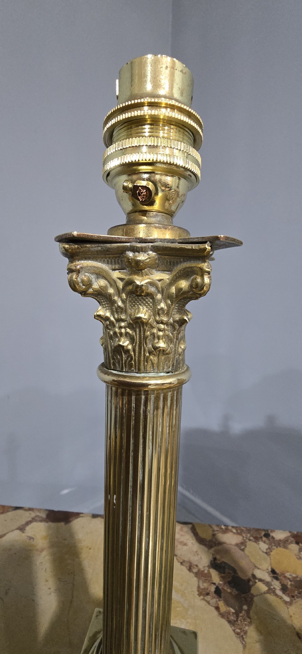 A pair of antique cast brass table lamps styled as classical fluted Corinthian columns with stepped bases. View III