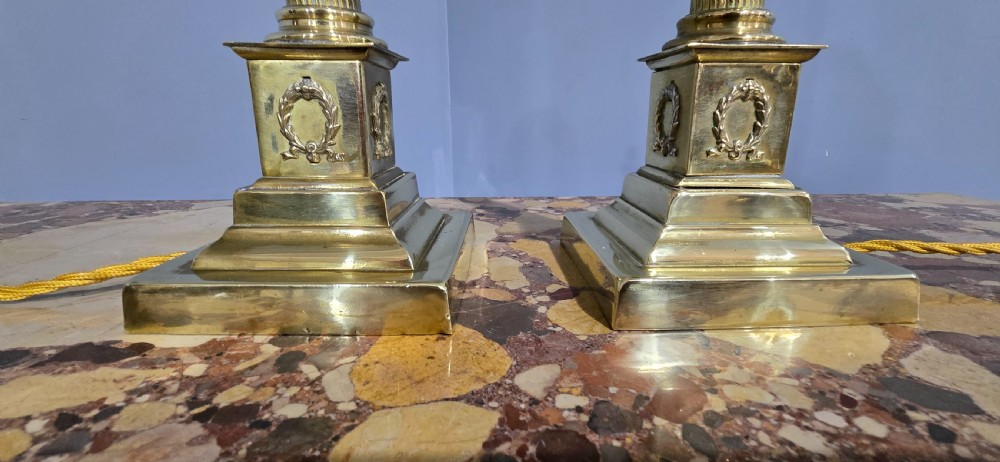 A pair of antique cast brass table lamps styled as classical fluted Corinthian columns with stepped bases. View IV