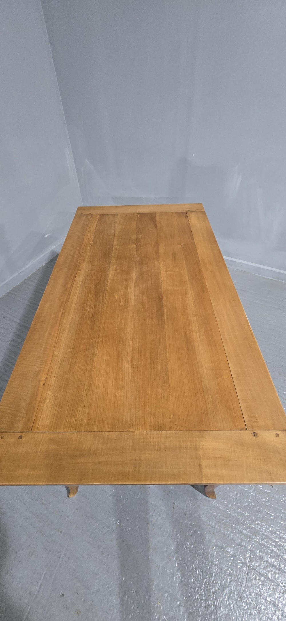 A French provincial solid cherry dining table featuring cabriole legs and a scalloped apron. View X