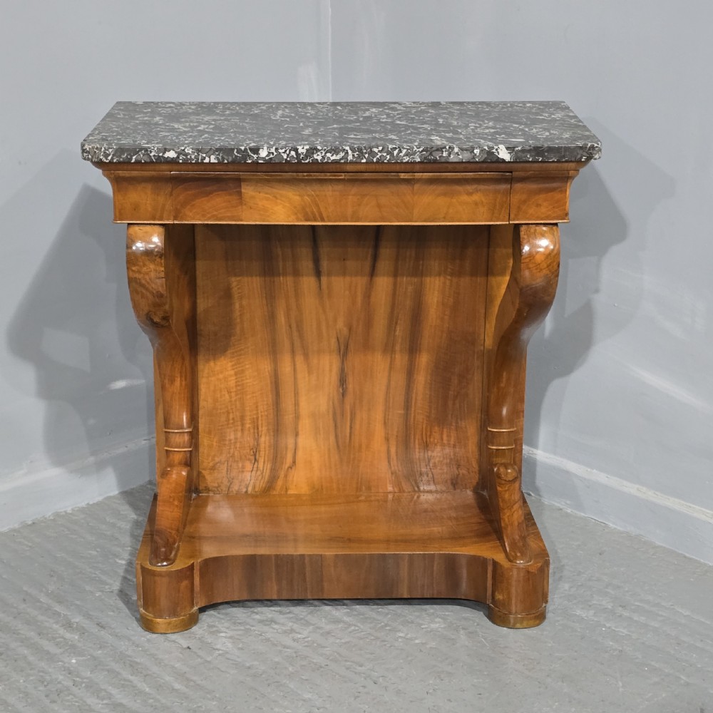 A nineteenth-century walnut console table featuring a grey-and-white mottled marble top supported by scrolling front legs and a solid base. View II