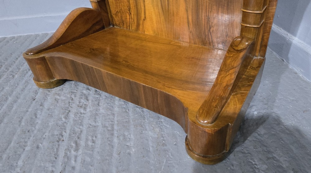 A nineteenth-century walnut console table featuring a grey-and-white mottled marble top supported by scrolling front legs and a solid base. View VII