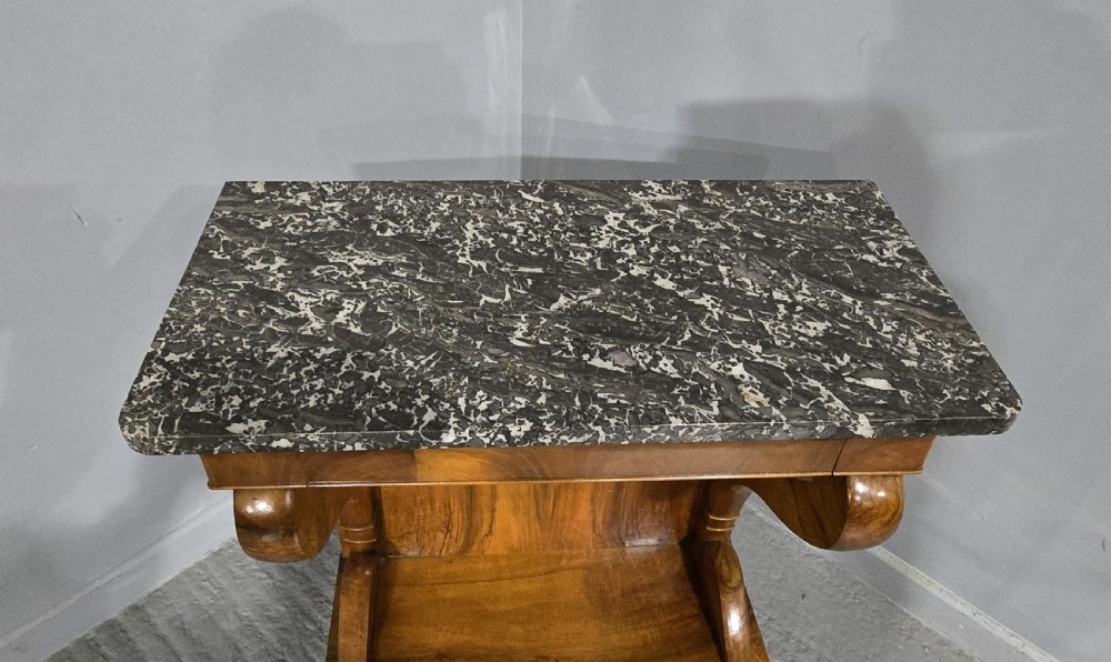 A nineteenth-century walnut console table featuring a grey-and-white mottled marble top supported by scrolling front legs and a solid base. View VIII