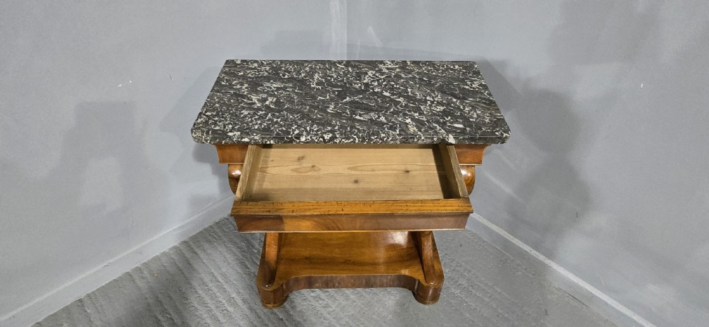 A nineteenth-century walnut console table featuring a grey-and-white mottled marble top supported by scrolling front legs and a solid base. View IX