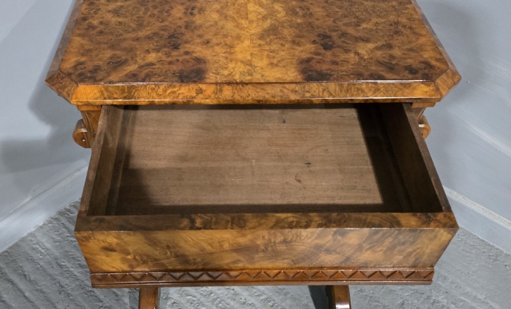 A Victorian burr walnut console table featuring a scalloped gallery back, rich burr veneer top, and carved shaped support legs connected by a central stretcher. View VIII