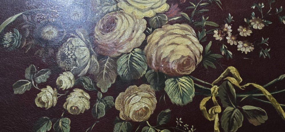An Italian painted tilt-top side table featuring a dark burgundy ground decorated with a central hand-painted floral bouquet and gilt scrollwork borders. View XVII