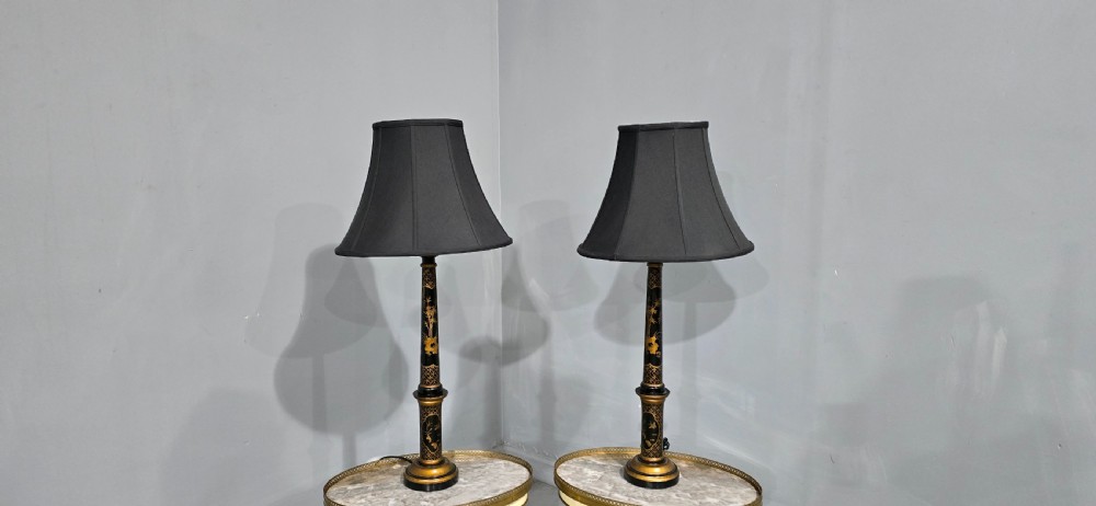 A pair of tall black lacquered table lamps featuring hand-painted gold Chinoiserie motifs and topped with black fabric shades. View VIII
