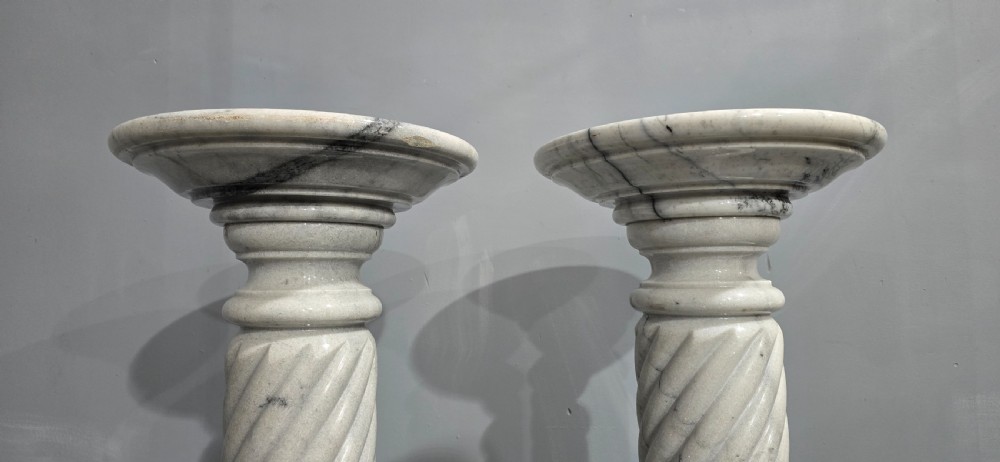 A pair of carved white and grey variegated marble pedestals with spiral shafts, circular capitals, and stepped moulded bases. View III