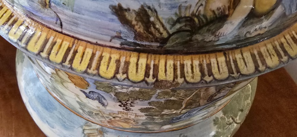 An 18th-century Italian tin-glazed earthenware lidded jar decorated with painted classical landscapes, cherubs, and architectural ruins. View XII