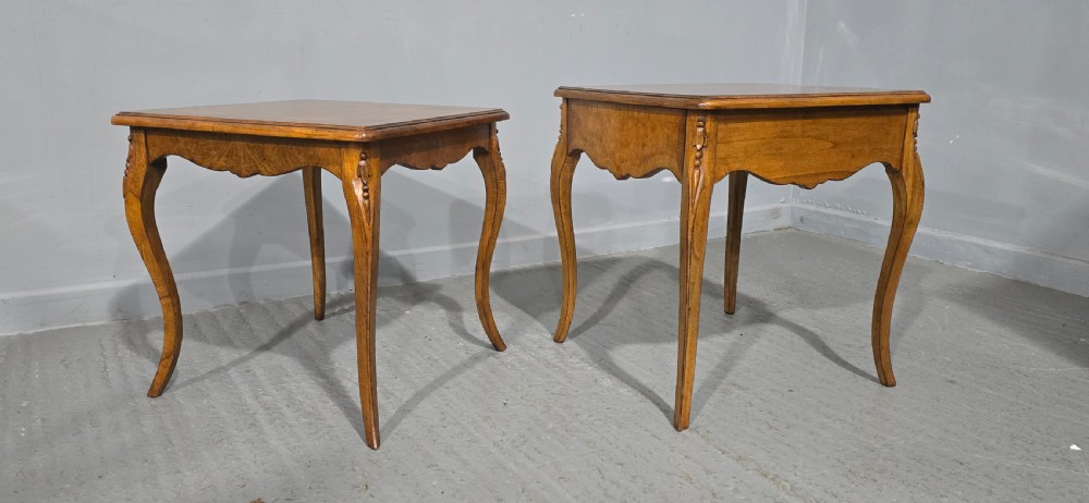 A matching pair of square burr elm lamp tables featuring figured timber tops, shaped friezes, and slender cabriole legs. View IV