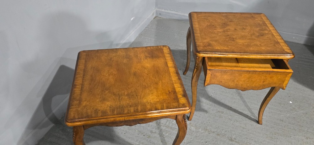 A matching pair of square burr elm lamp tables featuring figured timber tops, shaped friezes, and slender cabriole legs. View VI