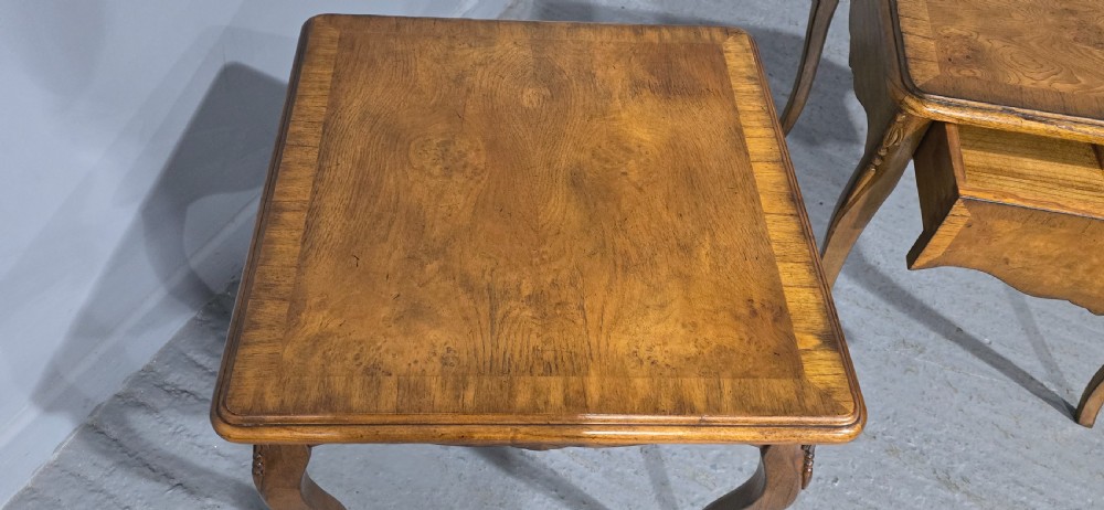A matching pair of square burr elm lamp tables featuring figured timber tops, shaped friezes, and slender cabriole legs. View VII
