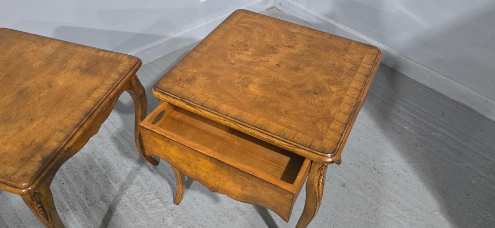 A matching pair of square burr elm lamp tables featuring figured timber tops, shaped friezes, and slender cabriole legs. View VIII
