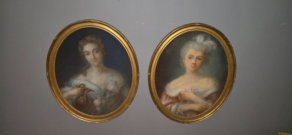 A pair of oval gilt-framed antique pastel portraits depicting two ladies in 18th-century attire. View III
