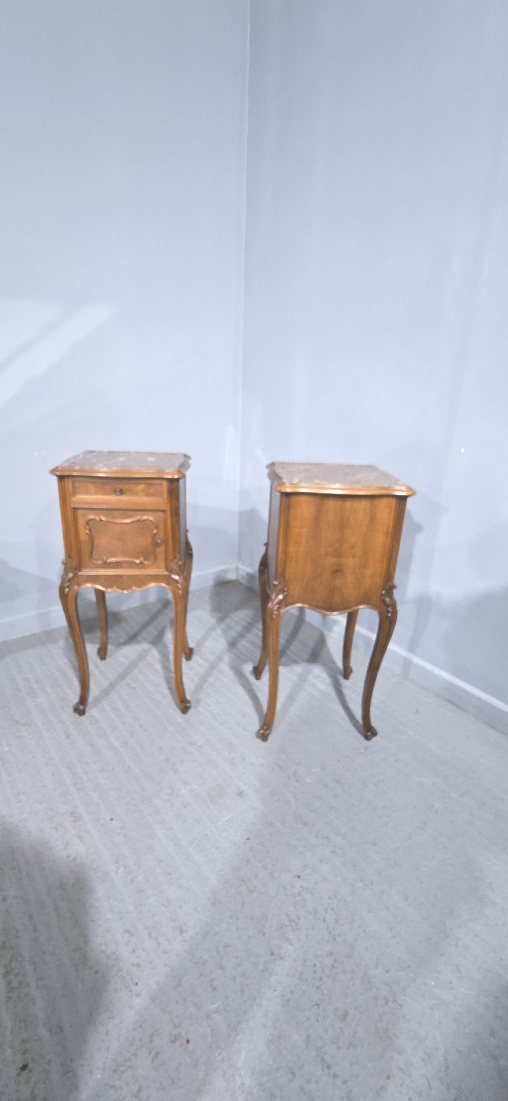A pair of tall, slender French walnut bedside tables featuring marble tops, single upper drawers, panelled cupboard doors, and cabriole legs. View XIII