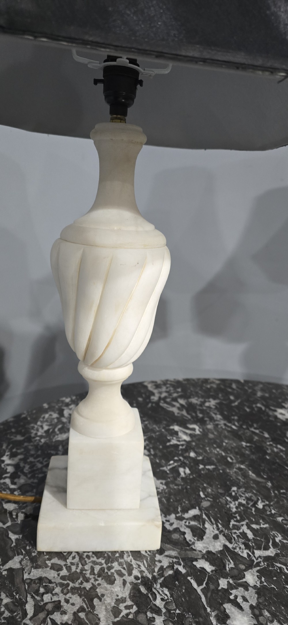 A pair of carved white marble table lamps with fluted urn bases and black flared shades. View VI