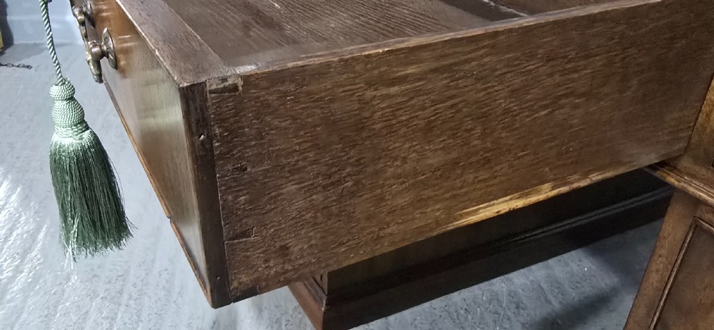 A double-pedestal mahogany partners desk featuring a leather-inset writing surface and brass swan-neck handles on multiple drawers. View X