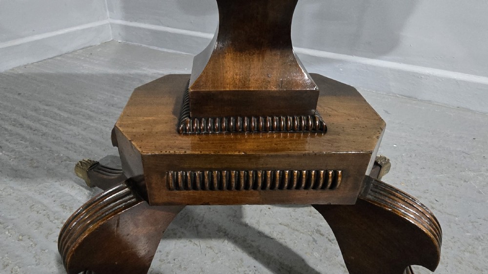 A Regency brass inlaid wooden card table featuring a fold-over top, central pedestal column, and four splayed legs with brass paw feet. View XI