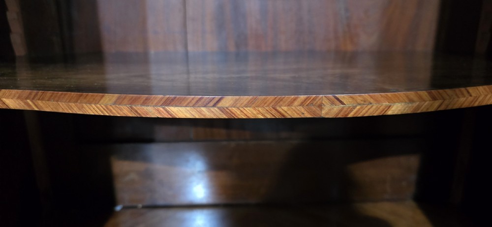 A French Louis XV style serpentine side cabinet featuring geometric cubework parquetry inlay, a single door, and decorative gilt-bronze mounts. View XIII